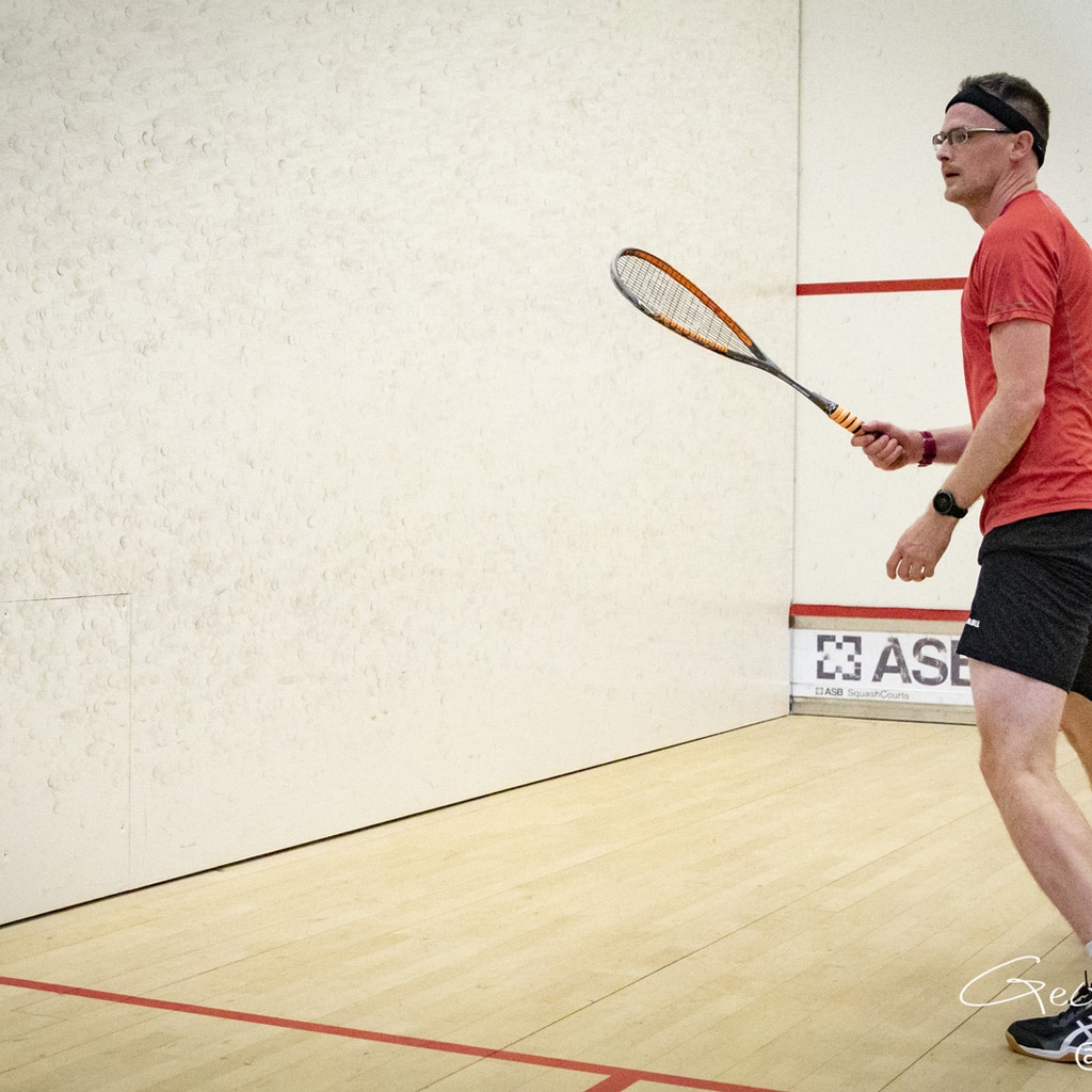 Squash player awaiting his opponent's choice of shot,